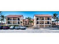 Stunning condominium complex boasts beautiful balconies, lush palm trees, and ample parking for residents and guests at 1760 Gulf Blvd # 603, Englewood, FL 34223