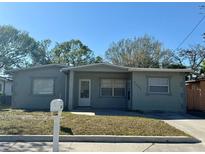 Charming single-story home with a well-maintained front yard and inviting curb appeal at 3035 Pershing Ave, Sarasota, FL 34234