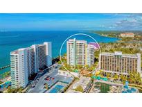 Stunning aerial view of beachfront condo featuring tennis courts, pool and boat slips at 990 Blvd Of The Arts # 1203, Sarasota, FL 34236