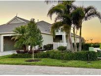 Beautiful one-story home featuring tropical landscaping, elegant architectural details, and a tile roof at 264 Van Gogh Cv, Bradenton, FL 34212