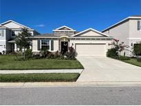 Charming single-story home with a two-car garage, lovely landscaping and stone accents at 5313 Halewood Ct, Bradenton, FL 34211