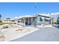 Charming single-story home featuring a covered patio and low maintenance gravel landscaping at 818 50Th Avenue W Ter, Bradenton, FL 34207