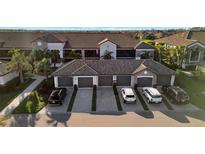 Beautiful townhomes with private garages and well-maintained landscaping at 5527 Palmer Cir # 105, Bradenton, FL 34211