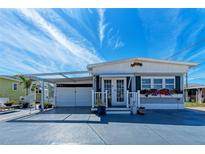 Charming single-story home with well-maintained landscaping, covered parking and appealing curb appeal at 10315 Cortez W Rd # 17F, Bradenton, FL 34210
