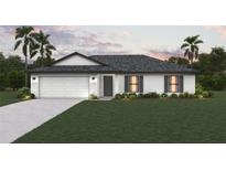 Charming single-Gathering home with a well-manicured lawn, two-car garage, and beautifully landscaped front yard at 12042 Crossgate Ave, Port Charlotte, FL 33981