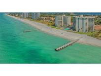 Beautiful aerial view of the beach, docks, and condo community at 2301 Gulf Of Mexico Dr # 33N, Longboat Key, FL 34228