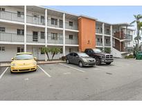 Multi-level condo building features ample parking spaces at 2326 Canal Dr # G25, Bradenton, FL 34207