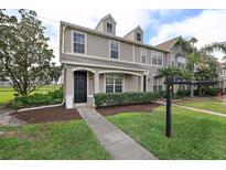 Charming two-story home with well-manicured lawn and inviting front entrance at 8850 Christie Dr, Largo, FL 33771
