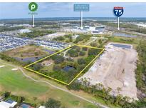 Expansive land parcel highlighted with nearby amenities including Publix and Sarasota Memorial Health Care at 2900 Curry Ln, Nokomis, FL 34275