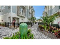 Charming townhome community with lush landscaping and paved walkways in a desirable location at 512 Laurel Park Dr, Sarasota, FL 34236
