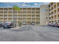 Multi-story condo building with ample parking and view of balconies at 3658 Lake Bayshore Dr # 320, Bradenton, FL 34205