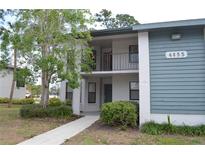 Inviting condo building featuring a mix of neutral and blue siding with a charming balcony at 4655 46Th Street W Ct # 201, Bradenton, FL 34210