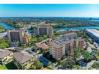Breathtaking aerial view showcases the complex's waterfront location with stunning views of the river at 5591 Cannes Cir # 403, Sarasota, FL 34231