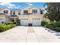 Charming two-story home with a two-car garage and well-manicured landscaping at 1102 Jonah Dr # 1102, North Port, FL 34289