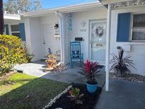 Charming condo with a cozy, decorated front entrance and curb appeal at 6032 Arlene Way, Bradenton, FL 34207