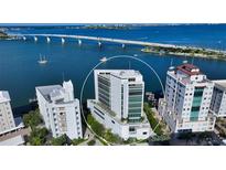 Aerial shot of the property highlighting its prime waterfront location and modern architectural design at 280 Golden Gate Pt # 400, Sarasota, FL 34236
