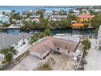 Waterfront property with boat docks and views of canal and bay in residential neighborhood at 507 59Th St, Holmes Beach, FL 34217