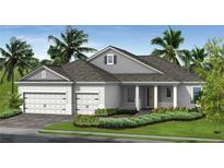 Charming one-story home featuring a two-car garage, covered entry, and beautifully landscaped front yard at 11077 Hogan Cir, Englewood, FL 34223