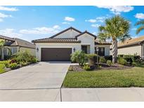 Charming home with manicured lawn and mature landscaping creates inviting curb appeal at 220 Cassano Dr, Nokomis, FL 34275