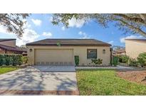 Charming single story home boasts a two-car garage, manicured lawn and mature trees in a desirable neighborhood at 3692 Glen Oaks Manor Dr, Sarasota, FL 34232