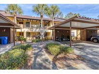 Charming condo with covered parking, lush landscaping, and inviting walkways at 4414 Spicewood Dr # H, Bradenton, FL 34208