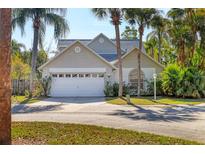 Charming single-Gathering home showcasing tropical landscaping and a two-car garage at 7821 Geneva Ln # 11, Sarasota, FL 34243