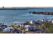 Stunning aerial view of a waterfront property with private dock and serene bay views at 1516 Sandpiper Ln, Sarasota, FL 34239