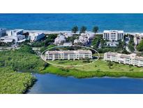 Beautiful condo with lush green lawn and stunning waterfront views of the ocean at 4600 Gulf Of Mexico Dr # 202, Longboat Key, FL 34228