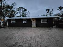 Charming home featuring simple architecture and a welcoming front door, enhanced by a paved driveway at 503 Olive Ave, Nokomis, FL 34275