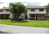 Well-maintained condo with manicured lawn and mature landscaping, offering great curb appeal at 6042 Red Maple Rd # 1001, Bradenton, FL 34210
