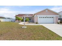 Charming single Gathering home featuring a two-car garage, well maintained lawn and mature landscaping at 9408 69Th E Ave, Palmetto, FL 34221