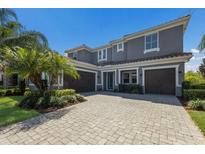 Stunning two-story home with a three-car garage and beautiful landscaping at 12022 Medley Ter, Lakewood Ranch, FL 34211