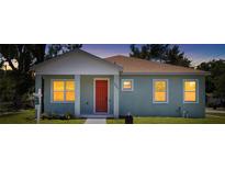 Charming single-story home boasts a well-maintained lawn, neutral paint, and inviting front porch at 1301 12Th S St, St Petersburg, FL 33705