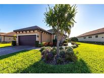 Charming home with a well-manicured lawn and lovely landscaping, enhancing its curb appeal at 4617 Alexandria Ct, Palmetto, FL 34221