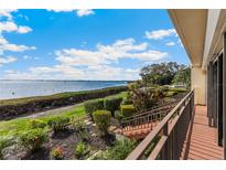 Beautiful water view from a private patio with manicured landscaping, offering a serene outdoor living space at 6430 Sun Eagle Ln # 103, Bradenton, FL 34210