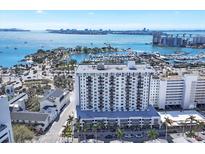 A scenic aerial view of the condo building with a view of the bay and city skyline at 101 S Gulfstream Ave # 14G, Sarasota, FL 34236