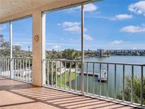Enjoy this condo balcony view overlooking the tranquil waterfront and blue skies at 3424 Lake Bayshore Dr # 405, Bradenton, FL 34205