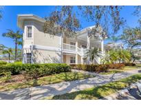 Beautiful two-story condo with landscaped yard and covered stairway entrance, perfect for Florida living at 3701 54Th W Dr # 103, Bradenton, FL 34210
