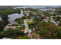 Neighborhood aerial view of a home with a waterfront view and mature landscaping at 2653 44Th S St, Gulfport, FL 33711