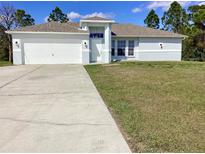 Charming single-Gathering home featuring an attached two-car garage and well-maintained landscaping at 8314 Drolet Ave, North Port, FL 34291