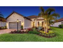 Charming single-story home features a well-manicured lawn, beautiful landscaping, and a two-car garage at 4717 Zeno Ct, Bradenton, FL 34211