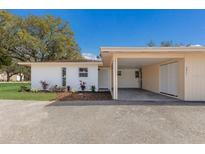 Charming one-story home with attached carport and freshly landscaped yard, and a classic Florida feel at 5011 Live Oak Cir # 65, Bradenton, FL 34207