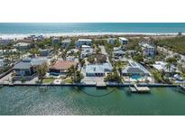 Stunning waterfront home with a private dock, beautiful landscaping, and Gulf views at 148 N Polk, Sarasota, FL 34236