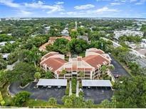 Beautiful aerial view of Hudson Harbour condo community featuring lush landscaping and covered parking at 800 Hudson Ave # 102, Sarasota, FL 34236