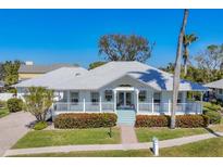 Charming single story home featuring a covered porch, beautiful landscaping, and a serene neighborhood setting at 8012 18Th W Ave, Bradenton, FL 34209