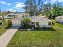 Charming single-story home with a well-manicured lawn and attached garage at 4062 Blitzen Ter, North Port, FL 34287