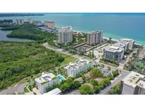 Coastal building near the ocean, offering beach access and luxurious amenities at 129 Taft Dr # W102, Sarasota, FL 34236