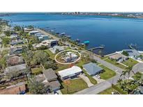 Waterfront home with a stunning view, lush landscaping and private dock at 2014 Riverside E Dr, Bradenton, FL 34208