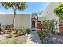 Charming single-story home with a well-maintained walkway, inviting curb appeal, and colorful landscaping at 622 Spring Lakes Blvd, Bradenton, FL 34210