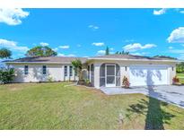Charming single-story home with well-maintained lawn and attached two-car garage at 2640 Geneva Rd, Venice, FL 34293